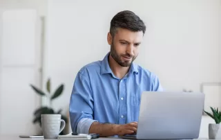 Business Lifestyle. Busy Office Worker Using Laptop At Workplace In Office